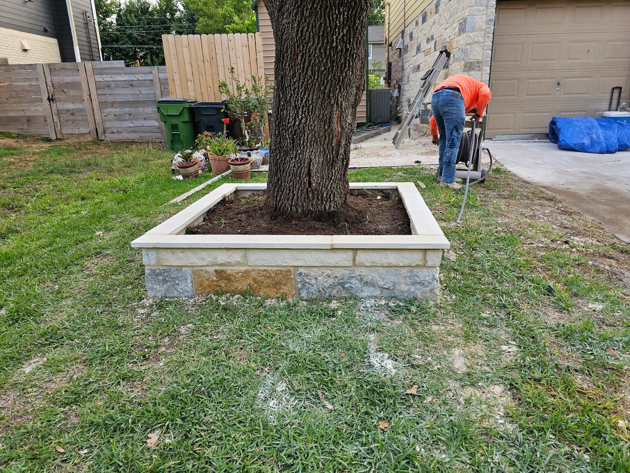 Custom limestone tree planter built by Ancfence LLC