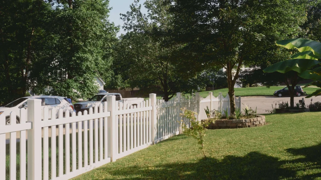 Professional white vinyl privacy fence installation for residential backyard